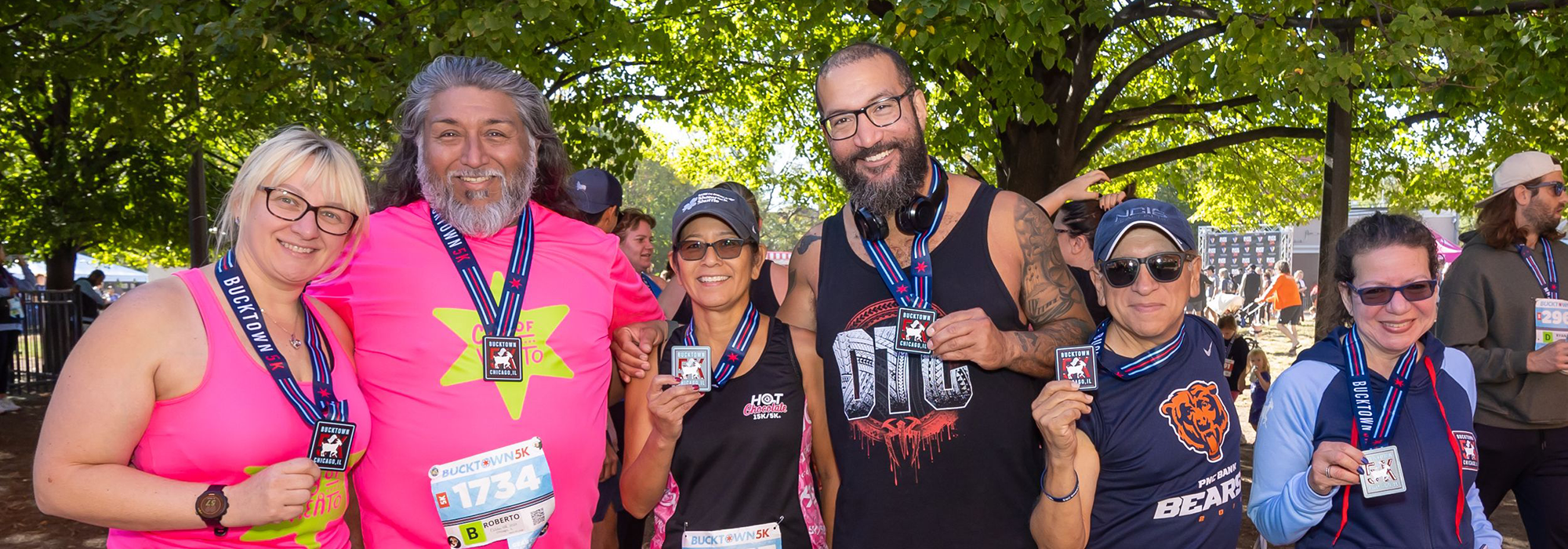 Group of runners with medals